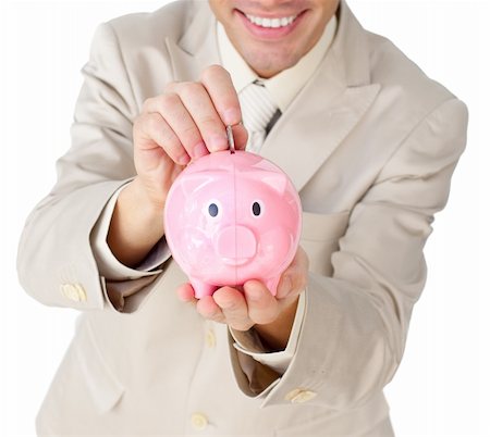 simsearch:400-04184165,k - Close-up of a businessman saving money in a piggy-bank against a white background Stock Photo - Budget Royalty-Free & Subscription, Code: 400-04183805
