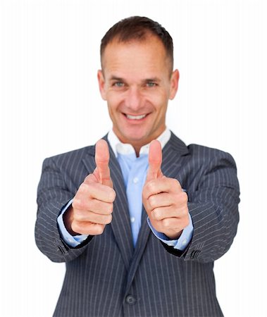 simsearch:400-04875087,k - Successful businessman with thumbs up smiling at the camera Photographie de stock - Aubaine LD & Abonnement, Code: 400-04183828
