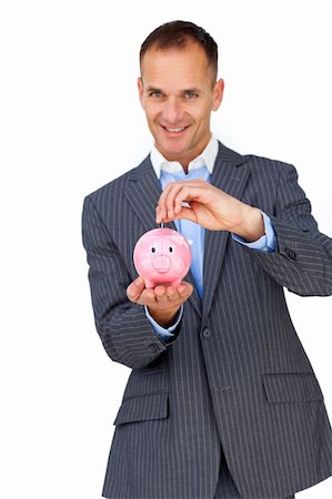 simsearch:400-04184165,k - Confident businessman saving money in a piggybank against a white background Stock Photo - Budget Royalty-Free & Subscription, Code: 400-04183845