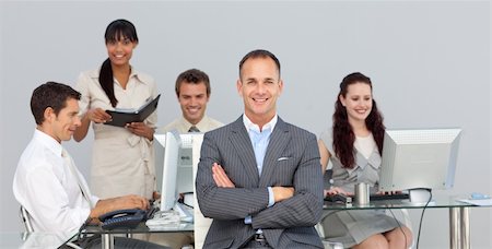 simsearch:400-04113367,k - Business partners working with their manager in the foreground Stock Photo - Budget Royalty-Free & Subscription, Code: 400-04183947