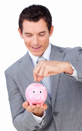 simsearch:400-05718324,k - Smiling businessman saving money in a piggy bank Stock Photo - Budget Royalty-Free & Subscription, Code: 400-04183970