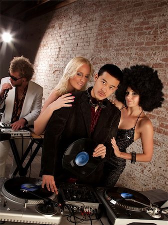 Handsome Asian DJ at a 1970s Disco Music Party Stock Photo - Budget Royalty-Free & Subscription, Code: 400-04194133