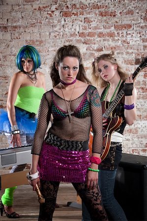 simsearch:400-04831298,k - Young all girl punk rock band performs in a warehouse Stock Photo - Budget Royalty-Free & Subscription, Code: 400-04194239