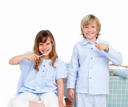 Smiling brother and siter brushing their teeth at home Stock Photo - Budget Royalty-Free & Subscription, Code: 400-04196891