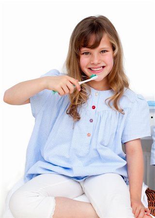 Portrait of a little girl brushing her teeth at home Stock Photo - Budget Royalty-Free & Subscription, Code: 400-04196892