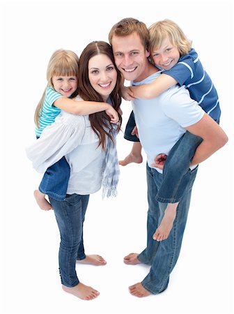 Loving family enjoying piggyback ride against a white background Stock Photo - Budget Royalty-Free & Subscription, Code: 400-04197404