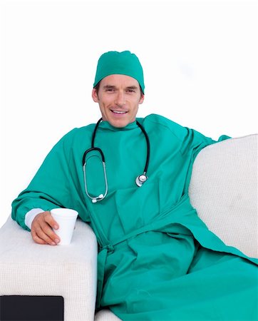 food specialist - Charismatic surgeon drinking coffee in the staff room against a white background Photographie de stock - Aubaine LD & Abonnement, Code: 400-04197857