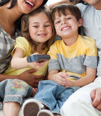 simsearch:400-04193348,k - Adorable children watching TV with their parents in the living-room Stock Photo - Budget Royalty-Free & Subscription, Code: 400-04198777