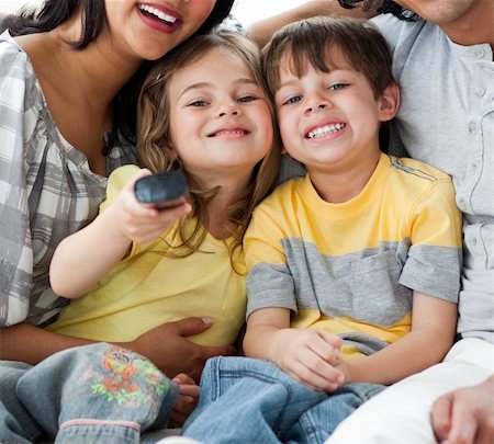 simsearch:400-04193348,k - Cute children watching TV with their parents in the living-room Stock Photo - Budget Royalty-Free & Subscription, Code: 400-04198772