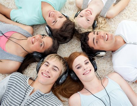 simsearch:400-04199223,k - Group of young friends listening to music on the floor Stock Photo - Budget Royalty-Free & Subscription, Code: 400-04199107