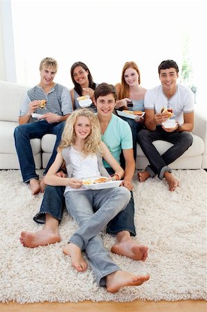 simsearch:400-04199223,k - Friends eating burgers and fries on the sofa Stock Photo - Budget Royalty-Free & Subscription, Code: 400-04199144