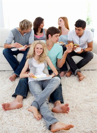 simsearch:400-04199223,k - Teenagers eating burgers and fries on the sofa Stock Photo - Budget Royalty-Free & Subscription, Code: 400-04199145