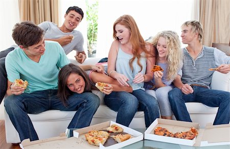 simsearch:400-04199223,k - Happy adolescents eating pizza at home Stock Photo - Budget Royalty-Free & Subscription, Code: 400-04199220