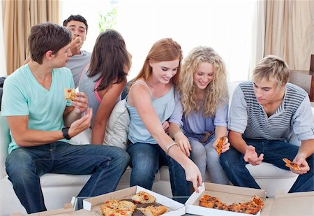 simsearch:400-04199223,k - Happy adolescents eating pizza at home Stock Photo - Budget Royalty-Free & Subscription, Code: 400-04199222