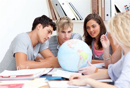 friend globe - Teenagers in a library working with a terrestrial globe and taking notes Stock Photo - Budget Royalty-Free & Subscription, Code: 400-04199273