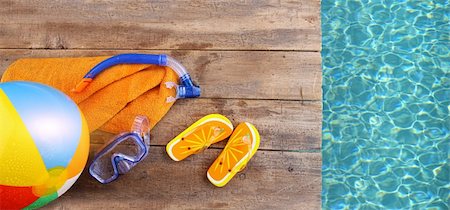 Summer fun background with flip flops, towel and goggles Stock Photo - Budget Royalty-Free & Subscription, Code: 400-04199695