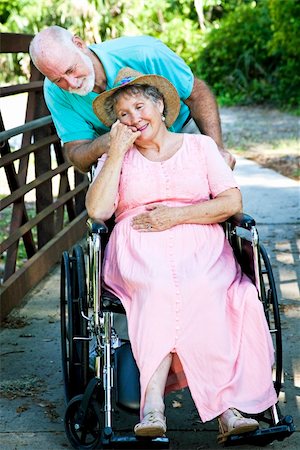simsearch:400-04208630,k - Senior man caring for his disabled wife in wheelchair. Stock Photo - Budget Royalty-Free & Subscription, Code: 400-04199845