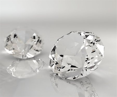 Two diamonds isolated on a reflective table Stock Photo - Budget Royalty-Free & Subscription, Code: 400-04199995