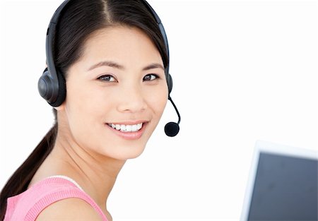 simsearch:400-05287143,k - Smiling businesswoman with headset on against a white background Stock Photo - Budget Royalty-Free & Subscription, Code: 400-04190002