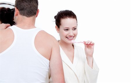 simsearch:400-04195864,k - Caucasian couple brushing his teeth against a white background Stock Photo - Budget Royalty-Free & Subscription, Code: 400-04190045