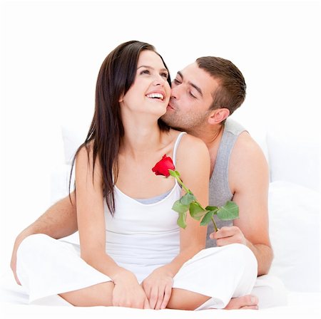 simsearch:400-04195864,k - Pretty couple kissing each other against a white background Stock Photo - Budget Royalty-Free & Subscription, Code: 400-04190089