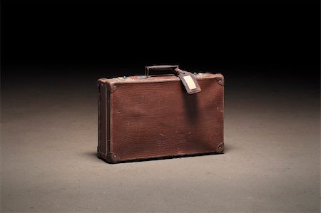 suitcase old - Old brown suitcase abandoned on dirty concrete floor Stock Photo - Budget Royalty-Free & Subscription, Code: 400-04190673