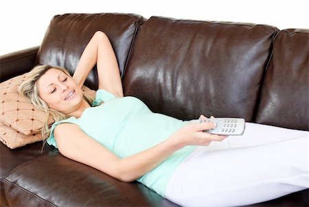 simsearch:400-04210845,k - Cute woman using a remote in the living-room Stock Photo - Budget Royalty-Free & Subscription, Code: 400-04190960