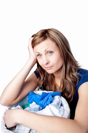 simsearch:400-04202340,k - Displeased woman doing laundry isolated on a white background Stock Photo - Budget Royalty-Free & Subscription, Code: 400-04192016