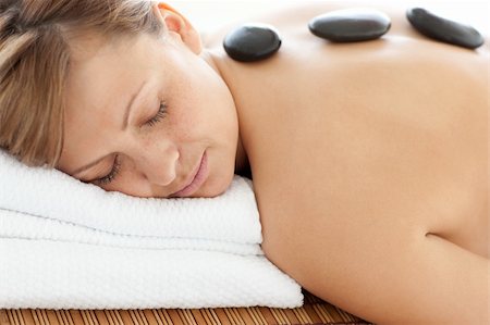 simsearch:400-04192063,k - Relaxed woman lying on a massage table having a stone therapy Stock Photo - Budget Royalty-Free & Subscription, Code: 400-04192061