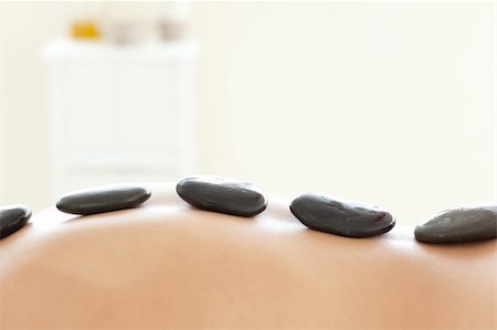 simsearch:400-04192083,k - Caucasian woman lying on a massage table having a stone therapy Stock Photo - Budget Royalty-Free & Subscription, Code: 400-04192063