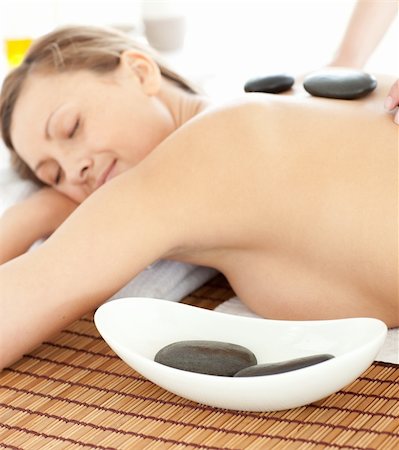 simsearch:400-04192083,k - Portrait of a radiant woman having a massage with stones at the spa Stock Photo - Budget Royalty-Free & Subscription, Code: 400-04192105