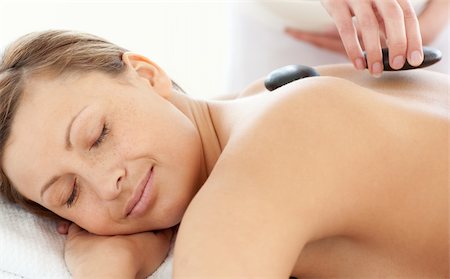 simsearch:400-04192063,k - Portrait of a relaxed woman having a massage with stones at the spa Stock Photo - Budget Royalty-Free & Subscription, Code: 400-04192100