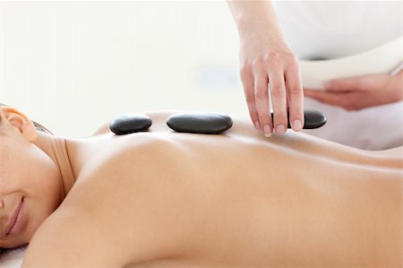 simsearch:400-04192063,k - Portrait of a beautiful woman having a massage with stones at the spa Stock Photo - Budget Royalty-Free & Subscription, Code: 400-04192102