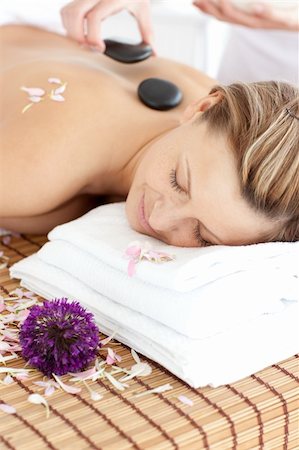 simsearch:400-04192063,k - Happy woman having a flower on a massage table Stock Photo - Budget Royalty-Free & Subscription, Code: 400-04192125