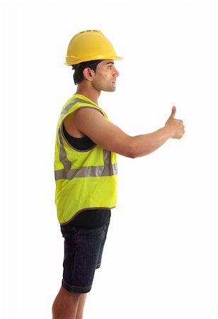 A construction worker, builder or other handyman or tradesman giving a thumbs up gesture.  White background. Foto de stock - Super Valor sin royalties y Suscripción, Código: 400-04193172