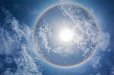 simsearch:400-04265415,k - Sun with sircular rainbow, clouds and blue sky Stock Photo - Budget Royalty-Free & Subscription, Code: 400-04204444