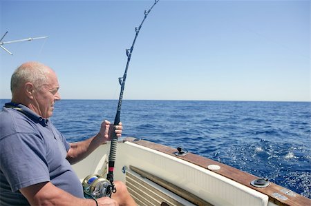 simsearch:400-05676936,k - Angler elderly big game sport fishing boat blue summer sea sky Stock Photo - Budget Royalty-Free & Subscription, Code: 400-04205477