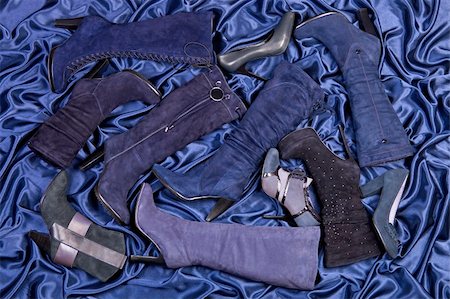 simsearch:400-07218273,k - Female blue boots and shoes placed on blue draped satin. Studio shot. Stock Photo - Budget Royalty-Free & Subscription, Code: 400-04205772