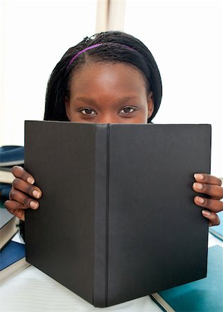 simsearch:400-04418460,k - Portrait of an attractive woman reading a book lying on a sofa Stock Photo - Budget Royalty-Free & Subscription, Code: 400-04206772