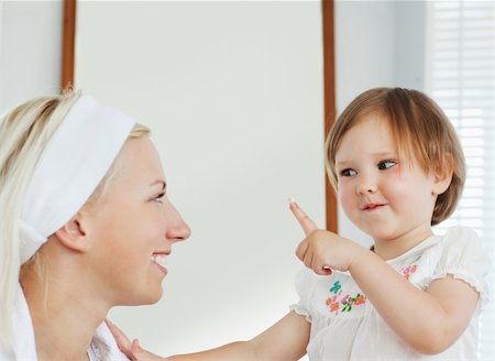 Smiling mother playing with her cute daughter in bathroom Stock Photo - Budget Royalty-Free & Subscription, Code: 400-04206800
