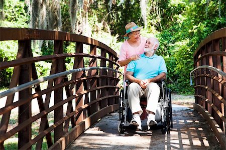 simsearch:400-04208630,k - Senior wife takes her disabled husband on a walk through the park. Stock Photo - Budget Royalty-Free & Subscription, Code: 400-04208605