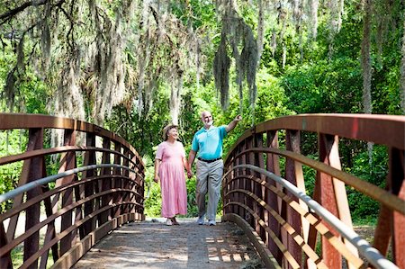simsearch:400-04208630,k - Senior couple walking together in the park. Stock Photo - Budget Royalty-Free & Subscription, Code: 400-04208640