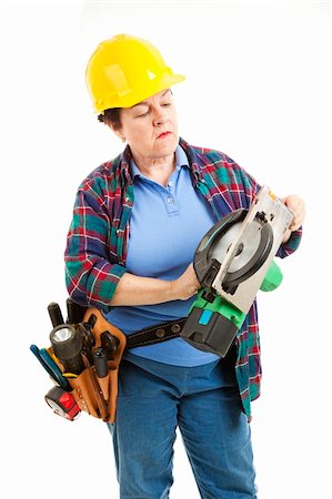plumber (female) - Female worker gets ready to fix a circular saw. Stock Photo - Budget Royalty-Free & Subscription, Code: 400-04208960