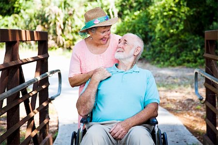 simsearch:400-04208630,k - Senior woman caring for her disabled husband in his wheelchair. Stock Photo - Budget Royalty-Free & Subscription, Code: 400-04209016