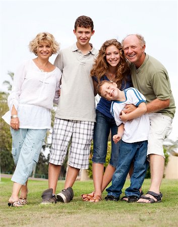 simsearch:400-07426233,k - Affectionate family of five posing outdors on sunny day Stock Photo - Budget Royalty-Free & Subscription, Code: 400-04209135