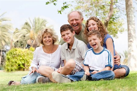 simsearch:400-07426233,k - Happy family having fun in the park, smiling and enjoying sunny day Stock Photo - Budget Royalty-Free & Subscription, Code: 400-04209142