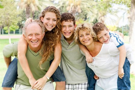 simsearch:400-07426233,k - garandparents giving piggyback ride to their children Stock Photo - Budget Royalty-Free & Subscription, Code: 400-04209150