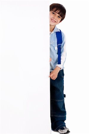 simsearch:400-04924737,k - Young kid standing behind the board on white isolated background Stock Photo - Budget Royalty-Free & Subscription, Code: 400-04209288