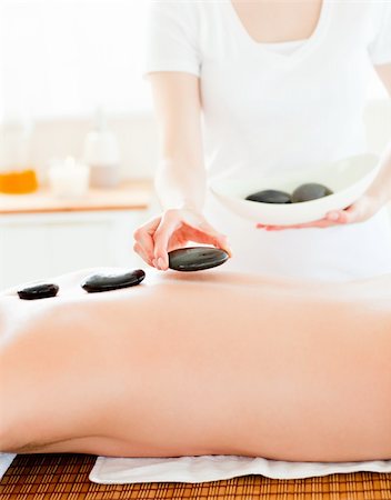 simsearch:400-04192063,k - Close-up of a young man having hot stone on his back in a health spa Stock Photo - Budget Royalty-Free & Subscription, Code: 400-04209924