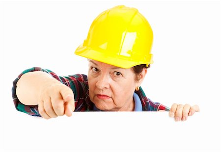 female plumber - Female construction worker leaning over blank space and pointing, with a warning look on her face.  Isolated design element. Stock Photo - Budget Royalty-Free & Subscription, Code: 400-04200034